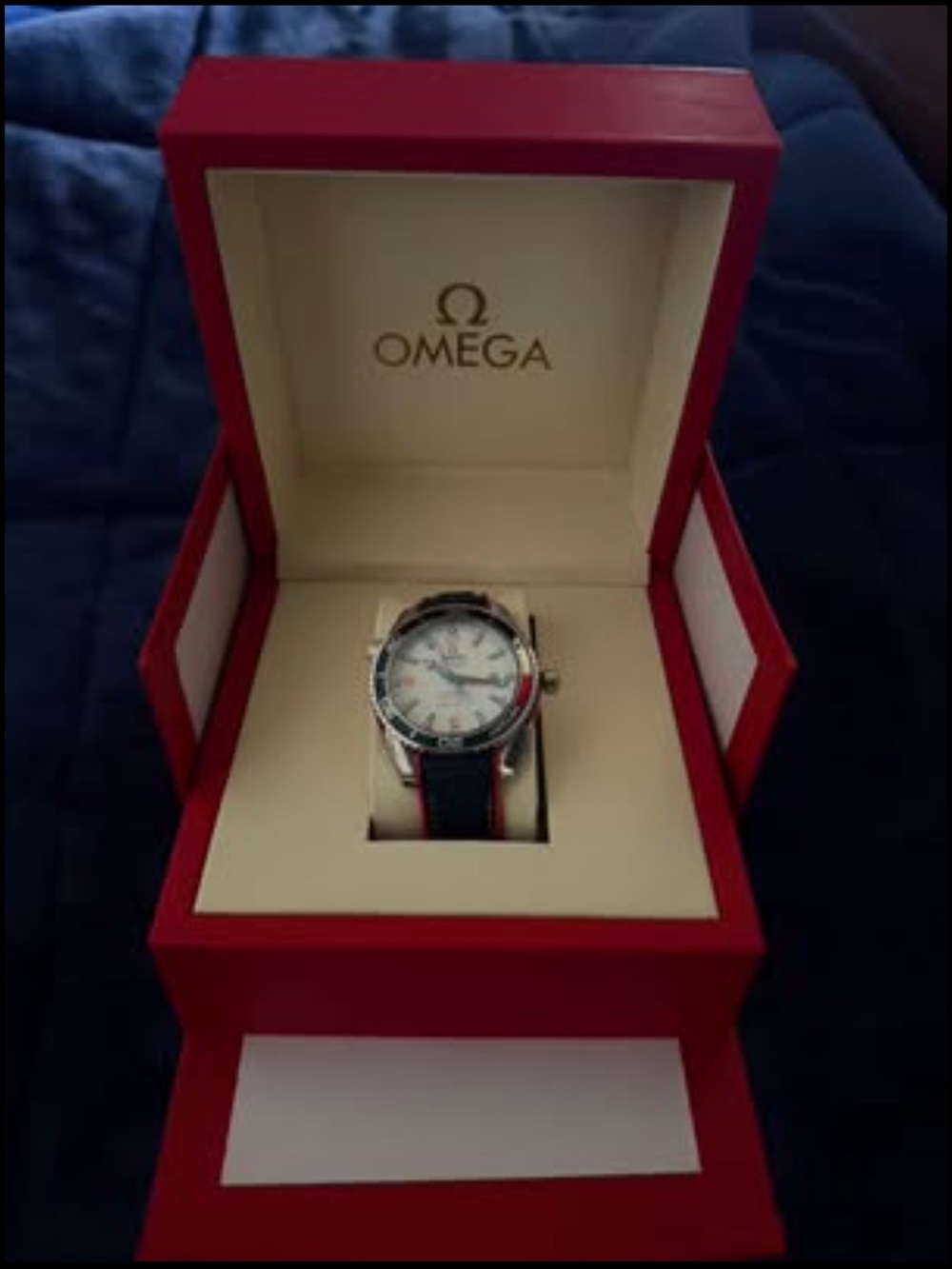 Omega Men's Watch with Blue Strap and Red Accents